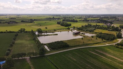 Fototapeta na wymiar Drone photo of lake house in dutch landscape
