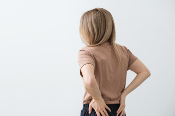 Young woman with back pain