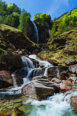 The nature, waterfalls and rivers of the Verzasca Val, Canton Ticino, during a sunny spring morning, near the town of Sonogno, Switzerland - May 2023