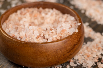 Pink natural salt on the table, close up