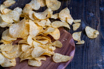 thin potato chips with spices, close up