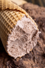 chocolate ice cream in a waffle cup on chocolate