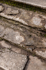 an old ruined concrete and stone staircase in the park