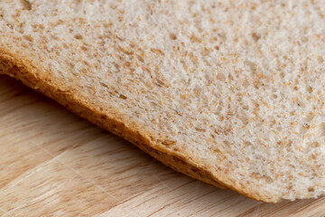 Square loaf of light wheat bread cut into pieces