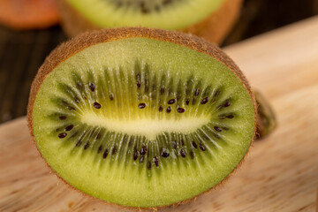green kiwi fruit cut into pieces, close up