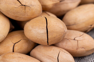 Unpeeled crunchy pecans close up