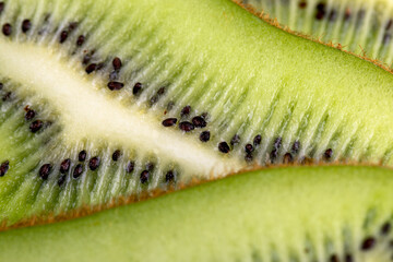 Ripe green kiwi sliced into thin slices