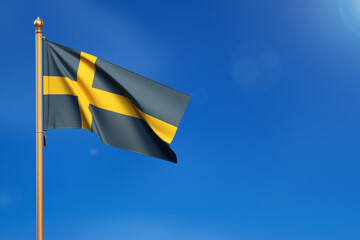 Sweden. Flag blown by the wind with blue sky in the background.
