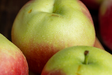 Fresh red and green apples on the kitchen table