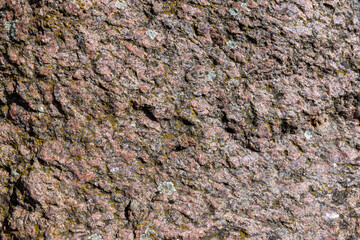 the structure of a red stone with other colors