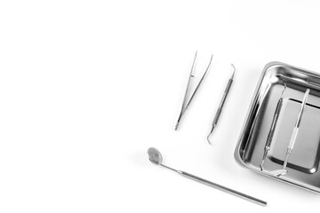 Set of metal medical dental equipment tools, top view. Teeth dental care concept