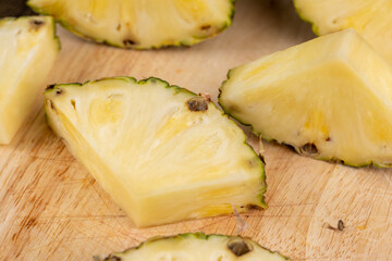 sliced ripe yellow pineapple, a large number of pieces