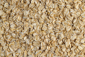 Poured a large amount of oat flakes close-up
