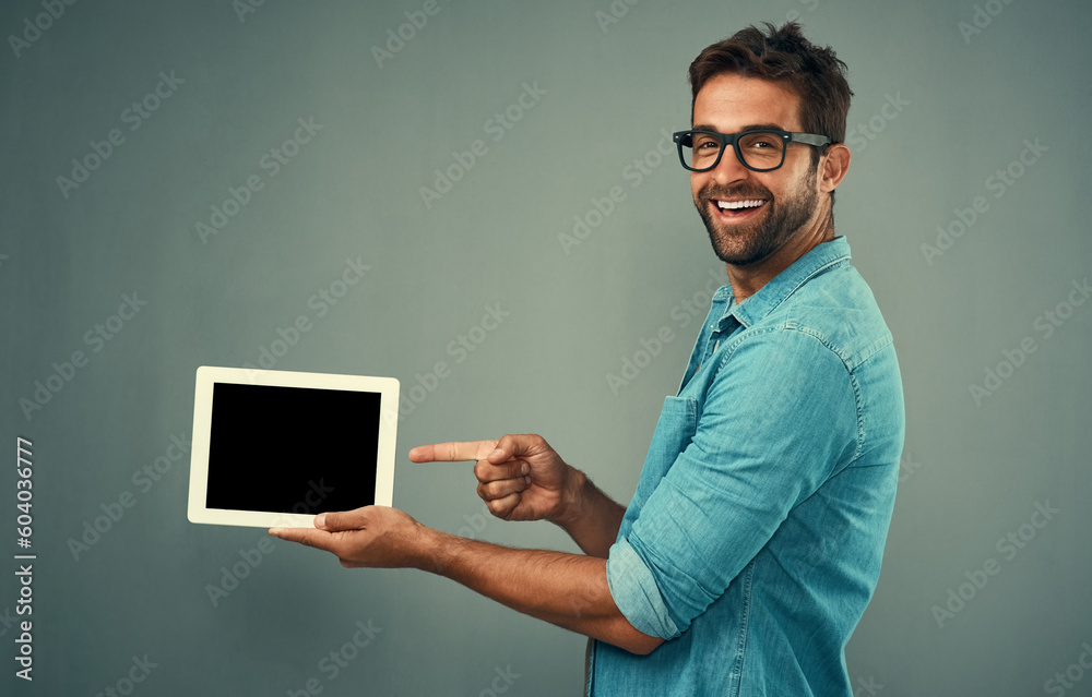 Aufkleber happy man, tablet and pointing to mockup screen for advertising against a grey studio background. po