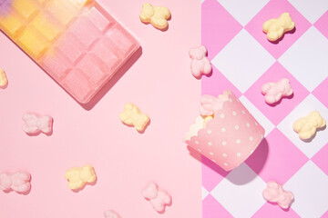 Pastel pink and yellow creative aesthetic dessert layout, retro style checkered pattern background. 