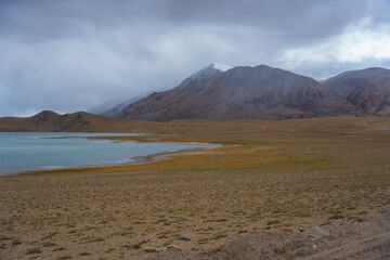 Landscape of Desert mountains against clouds sky at the way from Pangong Lake to Tso Moriri, Leh, Ladakh, Jammu and Kashmir, India