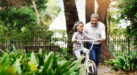 Bicycle, girl and grandfather in a park, teaching and happiness with fun, bonding and loving...