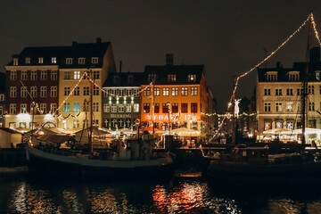 Copenhagen, Denmark - 24.12.2022 : Nyhavn district in Copenhagen, on Christmas eve - obrazy, fototapety, plakaty