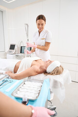 Woman in clinic on procedure laser peeling and CO2 resurfacing