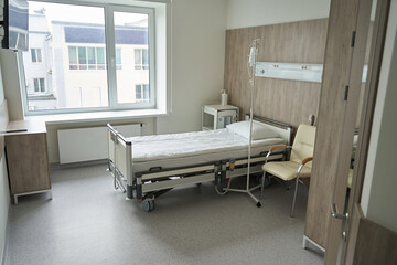 Photo of modern empty hospital room and bed
