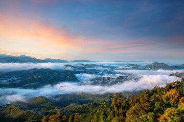 Fototapeta na wymiar Aiyerweng sea of mist with the mountains during sunrise time. The largest and most beautiful mist in the south of Thailand , Aiyerweng , Betong district , Yala province Thailand.
