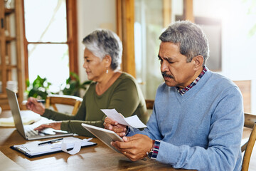 Budget, tablet and senior couple with bills, paperwork and tax documents for life insurance at...