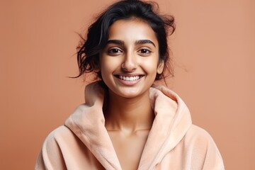 Fototapeta premium Young pretty indian woman wearing a bathrobe happy expression generative ai