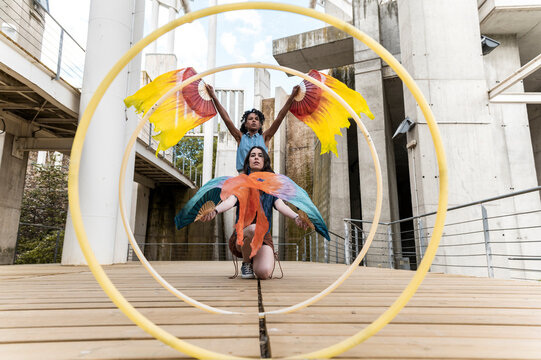 Multiracial women friends performing together and dancing expressing themselves
