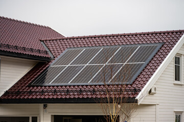 Solar cells installed on a garage roof.