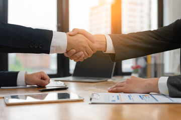 Executives are shaking hand after results success to target. financial data analysis and market...