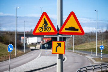 Signs warning of a bicycle crossing to the right.