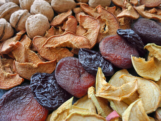 Natural healthy snack background. Dried apples, quince, apricots, prunes and walnuts.  
