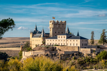 Fototapeta na wymiar Alcazar of Segovia at sunset. medieval castle located in the city of Segovia, in Castile and León, Spain. Was declared a UNESCO World Heritage Site in 1985. Today, it is used as a museum.