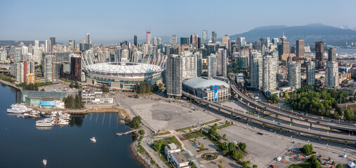 Fototapeta premium Vancouver, BC, Canada, aerial panoramic city view of famous False Creek in Vancouver downtown with Cambie Bridge and BC Place Stadium in front and Vancouver Skyline in the background 