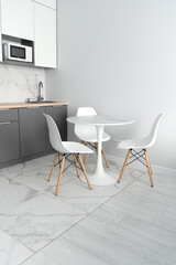 Modern interior of tiny studio appartment. Modern bedroom and kitchen in tiny home.