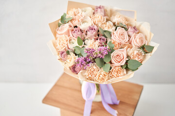 Beautiful bouquet of flowers on table. Floral shop concept . Beautiful fresh cut bouquet. Flowers delivery