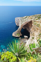 Beautiful view of a natural cliff bridge, the Blue Grotto on Malta island