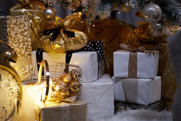 Christmas decoration. Christmas presents in boxes. Golden and brownish aesthetics.