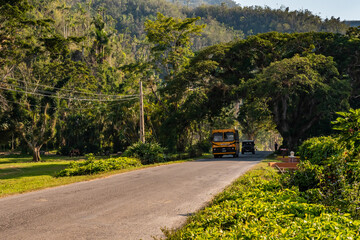 Old bus circulating in the countryside near Vinales in Cuba