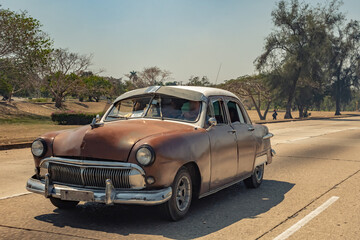 Old American car on the highway in Cuba