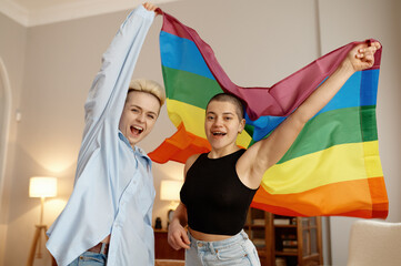 Young LGBTQ couple lovers feeling proud and preparing for tolerance parade show