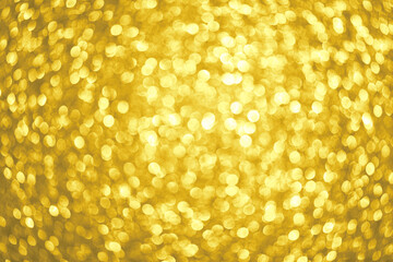 Abstract festive elegant golden background of blurred with bokeh lights and stars texture