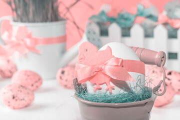 Easter decor with selective focus. Holiday still life with decorative eggs in a bucket with copy space for text