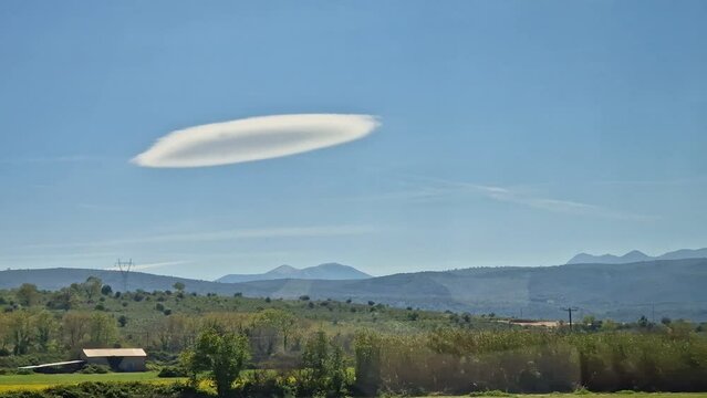 Interesting cloud formation over the spring landscape in western Greece near the Ambracian Gulf

