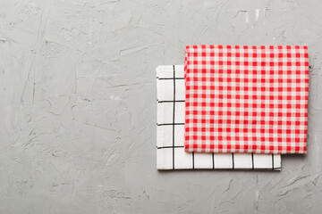 top view with red empty kitchen napkin isolated on table background. Folded cloth for mockup with...