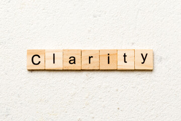 clarity word written on wood block. clarity text on table, concept