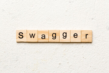 swagger word written on wood block. swagger text on table, concept