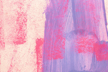 Messy paint strokes and smudges on an old painted wall. Pink, purple, beige color drips, flows,...