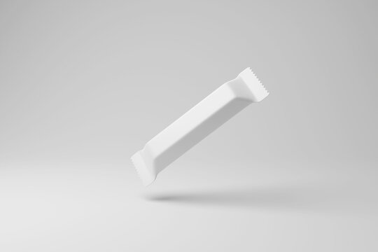 White chocolate bar package floating in mid air with shadow on white background in monochrome. Illustration of the concept of confectionery and sweet industry