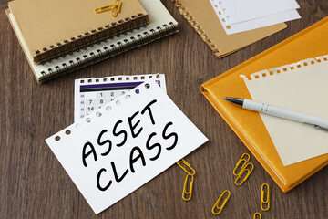 Asset Classes beautiful yellow notepad on the work table. text on the page